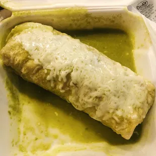 Fried fish burrito (wet) with green sauce. Huge burrito &amp; so delicious!