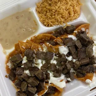 Red chilaquiles with Carne Asada