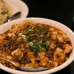 a bowl of soup and a plate of rice