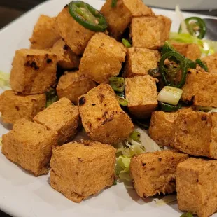 a plate of fried tofu