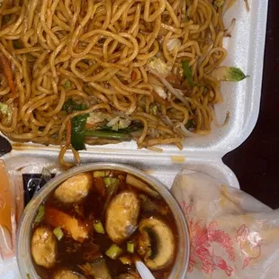 a tray of noodles and a bowl of soup