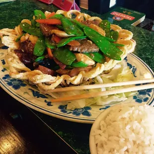 Holy sh.... This is the Phoenix Nest.  Why they decide to put iceberg lettuce underneath all of their food is beyond me.