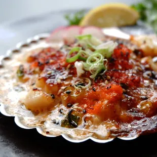 a scallop dish on a plate