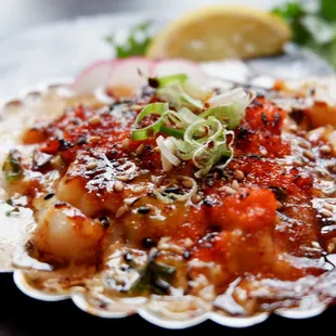 a scallop dish on a plate