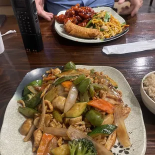 Schezuan Chicken entree (foreground) w General Tso&apos;s Chicken combo plate (background)