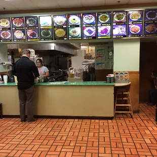 Inside. Very small. Plan to take it to go - do not plan to eat inside restaurant.