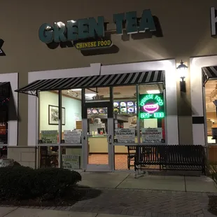 Front of store. Workers kids playing on the right side of the restaurant.