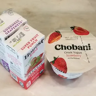 a box of chobani yogurt and a container of strawberry yogurt