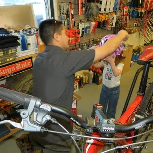 Outfitting our little girl with her first safety helmet!