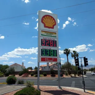 a gas station sign and a gas station