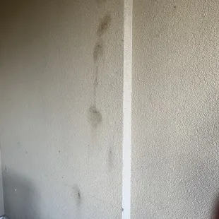 Filthy walls in balcony area. Cigarette or marijuana burn on seat covers on balcony chains.