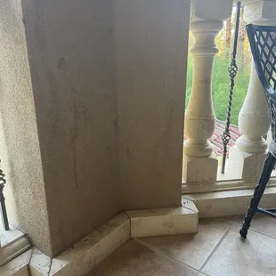 Very dirty walls and floors on balcony