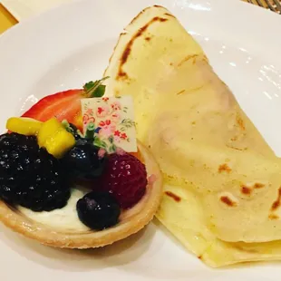 Beautiful fruit tart and berry crepe