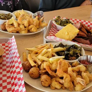 Sausage sandwich with cheesy grits, 2 Shrimp, fries and greens dinners, sausage, cornbread, mac n cheese.