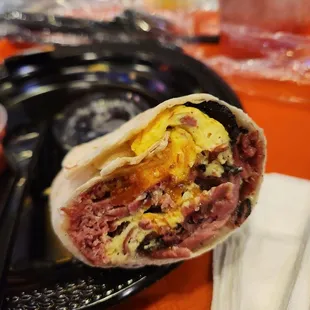 Delicious pastrami burrito for breakfast I think it had corned beef in it too it was fantastic and a steal for 9 bucks are you kidding me?