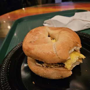 Bagel with pastrami and eggs.