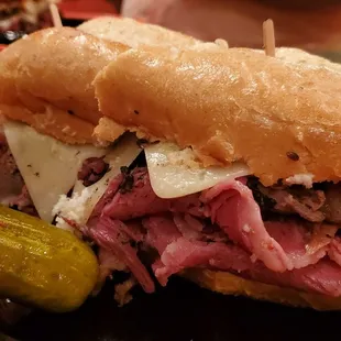 Corned beef and pastrami and swiss on a roll