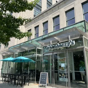 Front entrance with a few outdoor seats