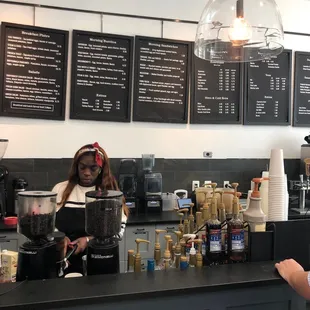 a woman working behind the counter