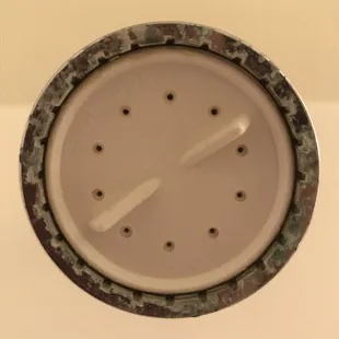 Our "brand new" shower head when we moved in.
