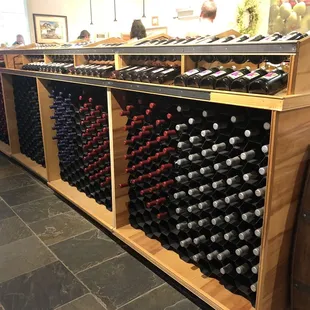 rows of wine bottles on display