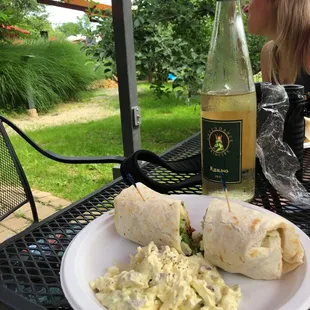a plate of food and a bottle of wine