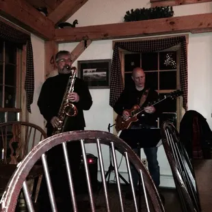 two men playing instruments