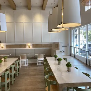 a dining room with tables and chairs