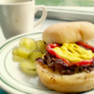 Double cheese burger with coffee for lunch.