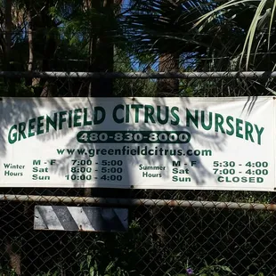 a sign on a chain link fence