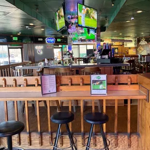 bar seating and televisions