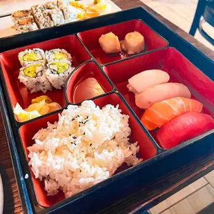 a bento box of sushi and rice