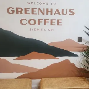 two benches in front of a sign