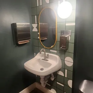 a bathroom with a sink and mirror
