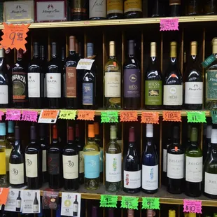 a shelf full of wine bottles