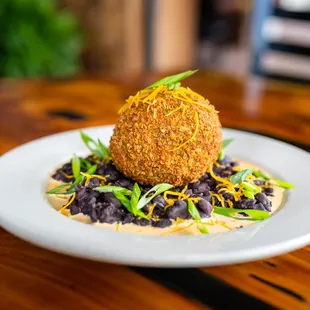 a plate of food on a wooden table