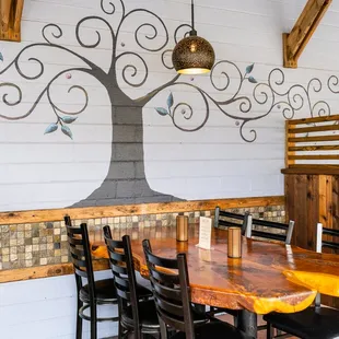 a tree mural on the wall