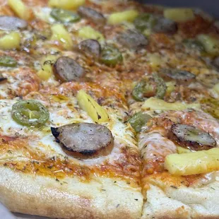 Build your own pizza - sausage, jalapeño, pineapple, extra virgin olive oil, and Mediterranean herbs! BOMB
