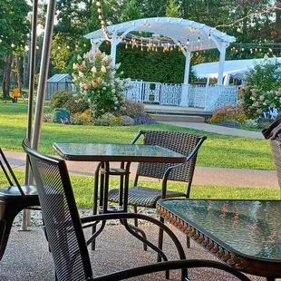 a patio with tables and chairs