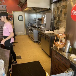 a woman standing in the kitchen