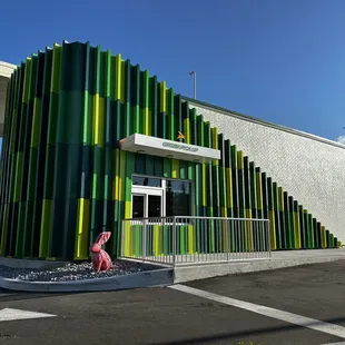 a colorful building with a stop sign in front of it