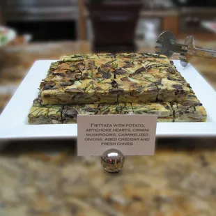 Frittata with potato, artichoke hearts, crimini mushrooms, caramelized onions, aged cheddar and fresh chives