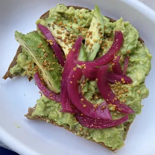 Fresh Avocado, gourmet wheat toast, organic EVOO, pickled onions, Himalayan sea salt, and bee pollen