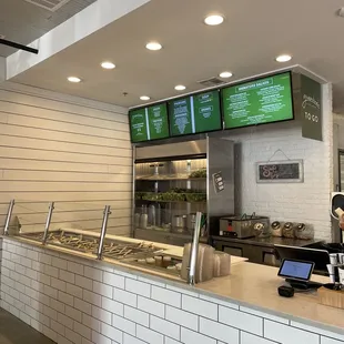 a restaurant counter and menus