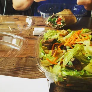 a salad in a bowl and a salad in a bowl on a table