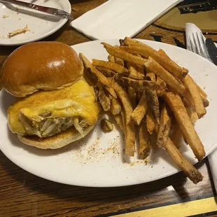 Crabcake sandwich with cheese and french fries