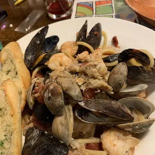 a plate of seafood and pasta