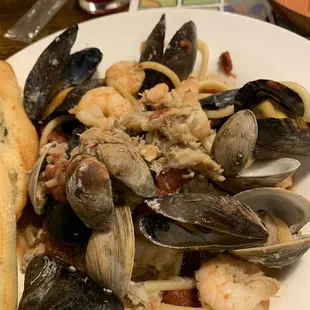 a plate of seafood and pasta
