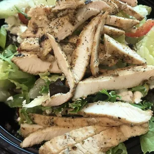 a plate of chicken and lettuce