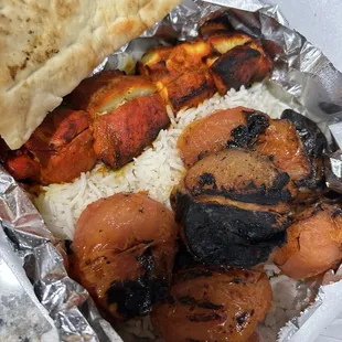 Spicy chicken kabob and tomato kabob